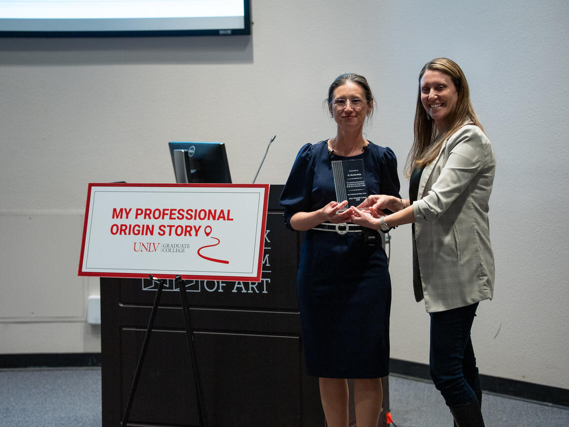 Woman presented an award for "My Professional Origin Story"
